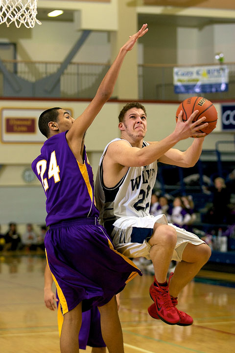 Senior Dom Young draws a foul on a shot attempt against Lathrop