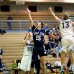 Senior Nate Yaw floats a shot up in the second half against Chugiak