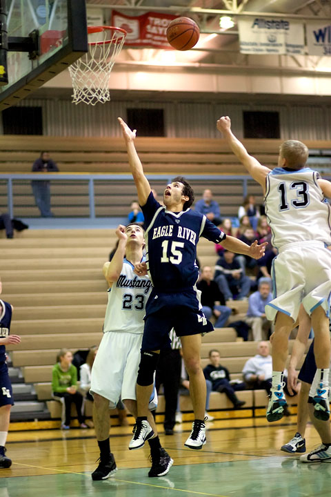 Senior Nate Yaw floats a shot up in the second half against Chugiak