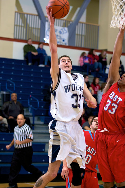 Senior Colten Palmer goes to the rack against East