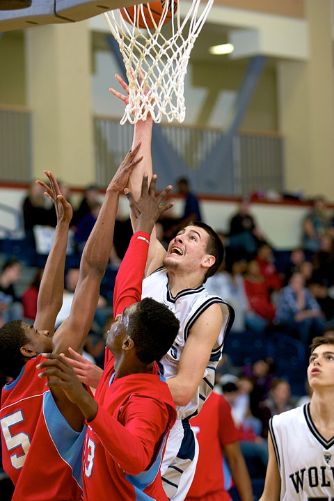 Senior Colten Palmer goes over the East defense for a shot