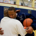 Coach Bowyer and Varsity Coach Craig Harrison hug after Coach Bowyers' last game as JV coach