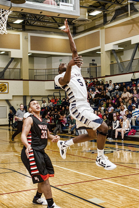 Senior Chris Parker shoots over the West defense