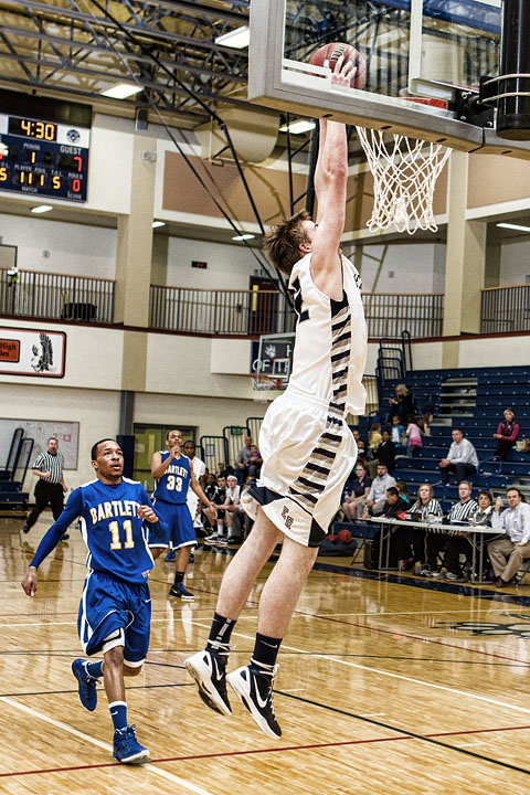 Senior Kevin Waterman closes out his high school hoops career with a two handed jam