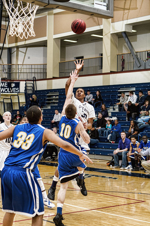 Chaz Jenkins floats a shot up over the Bartlett defense