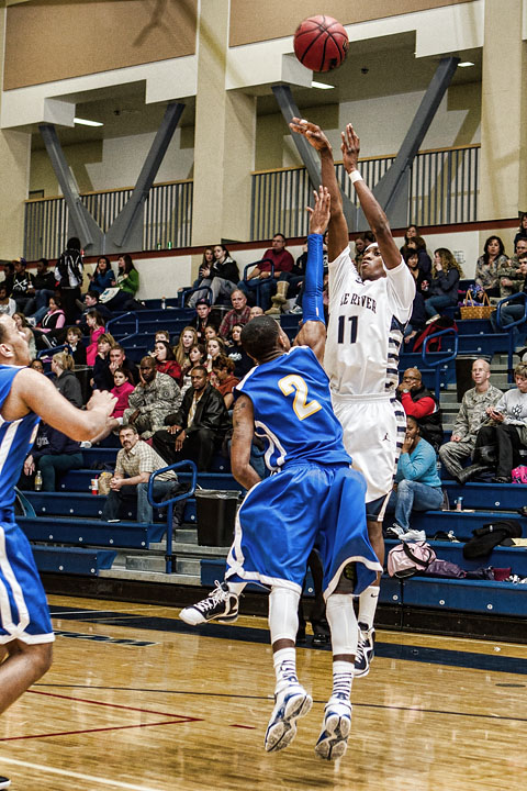 Junior Shaquan Rhoades shoots over the Bartlett defense Wednesday night