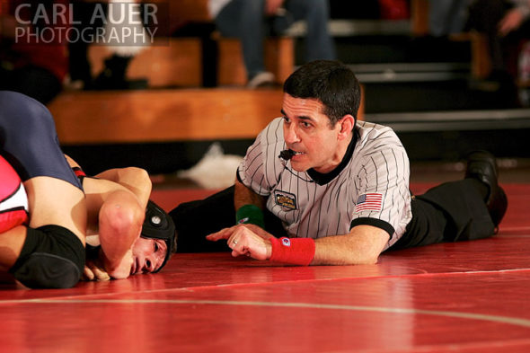 December 12th, 2012: The referee gets right down with the action between Mullen High School and Arvada at Arvada Senior High School