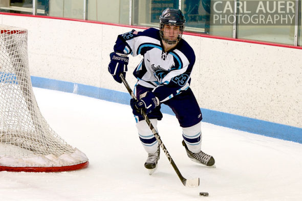 January 11th, 2013: A Ralston Valley hockey player brings the puck around from behind the goal in the game against Battle Mountain at the Apex Ice Arena on Friday night in Arvada, CO