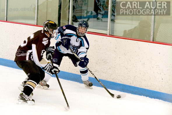 January 11th, 2013: A Ralston Valley hockey player passes the puck past a Battle Mountain player in their game at the Apex Ice Arena on Friday night in Arvada, CO