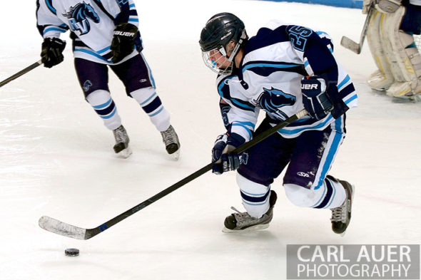 January 11th, 2013: A Ralston Valley hockey player speeds through his own zone after getting control of the puck in the game against Battle Mountain at the Apex Ice Arena on Friday night in Arvada, CO