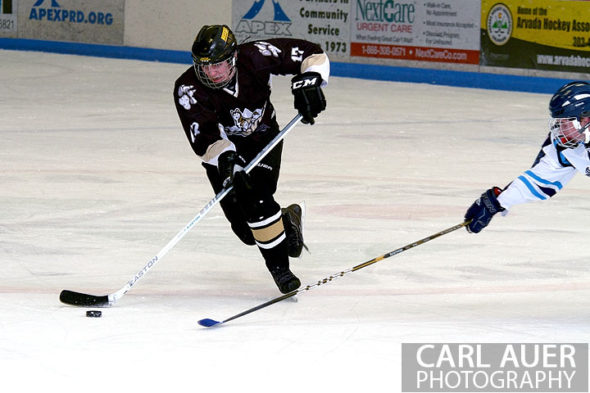 January 11th, 2013: A Battle Mountain player takes a slap shot from close to center ice in the game at the Apex Ice Arena against Ralston Valley on Friday night in Arvada, CO