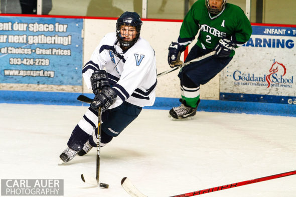 February 22, 2013: Arvada, Colorado - A Valor Christian hockey player with the puck in the game against Standley Lake High School at the Apex Center in Arvada