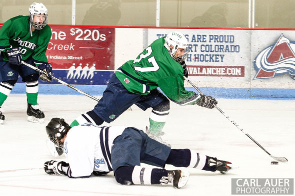 February 22, 2013: Arvada, Colorado - Standley Lake Gators forward Ryan Brooks takes the puck past a diving Valor Christian player in the playoff game at the Apex Center in Arvada