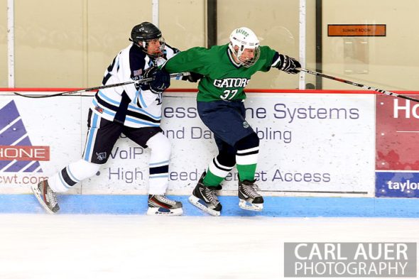 February 6th, 2013: Standley Lake Gators forward Ryan Brooks (37) tries to get away from Ralston Valley Mustang defender Brendan Aleksivich (22) in their game at the Apex Ice Arena in Arvada, Colorado