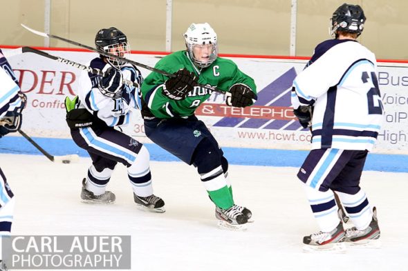 February 6th, 2013: Standley Lake Gators forward Mitch McEwan (8) attempts to split the Ralston Valley Mustang defense in their game at the Apex Ice Arena in Arvada, Colorado