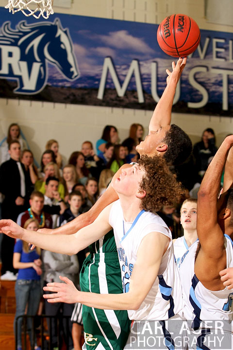 February 8th, 2013: Bear Creek Bears guard D.J. Miles (1) puts up a shot over the Ralston Valley Mustang defense in the game at Ralston Valley in Arvada, Colorado