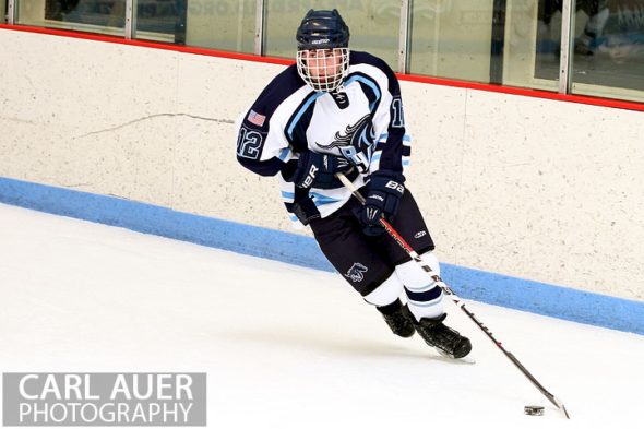 February 6th, 2013: Ralston Valley Mustang defender Victor Lombardi (12) brings the puck around the goal in the game against Standley Lake at the Apex Ice Arena in Arvada, Colorado