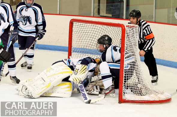 February 6th, 2013: Bodies pile into the Ralston Valley goal after Mustang goalie Zach Larocque (31) failed to stop a shot by the Standley Lake Gators in their game at the Apex Ice Arena in Arvada, Colorado