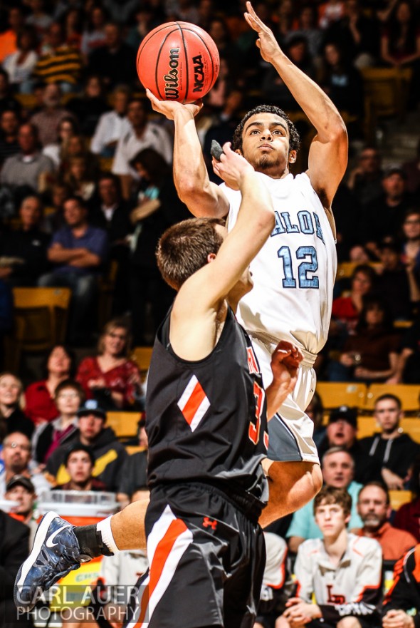 March 16th, 2013: Valor Christian Eagles junior guard Marcus Wilson (12) hangs in the air for his shot attempt over Lewis-Palmer Rangers senior guard Tyler Owens (35) in the CHSAA 4A State Championship game at the Coors Events Center in Boulder, Colorado