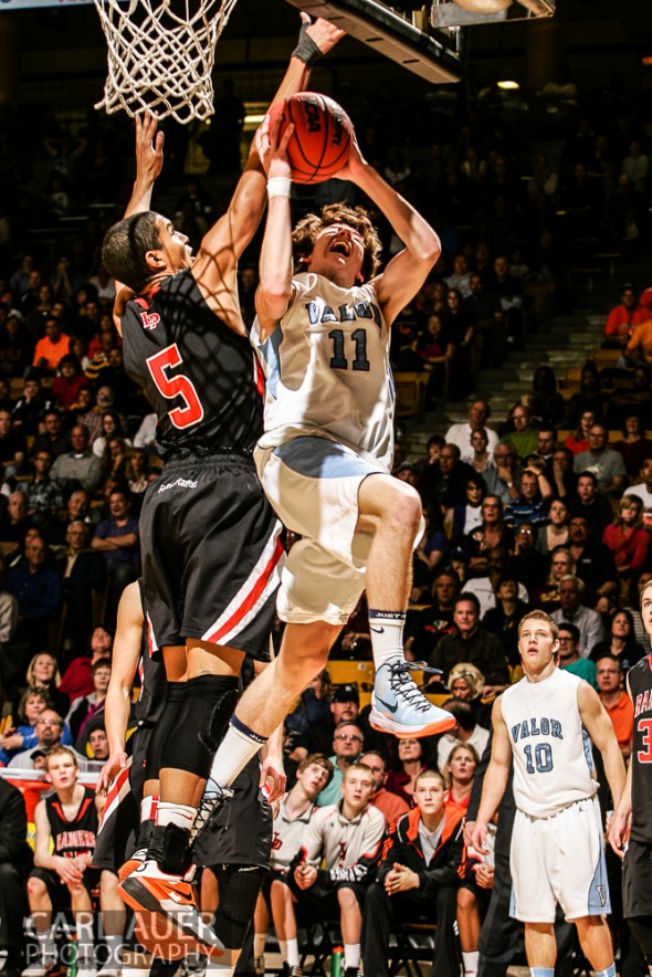 March 16th, 2013: Valor Christian Eagles junior guard Paden Mueller (11) attempts a shot past Lewis-Palmer Rangers senior guard/forward Jordan Scott (5) in the CHSAA 4A State Championship game at the Coors Events Center in Boulder, Colorado