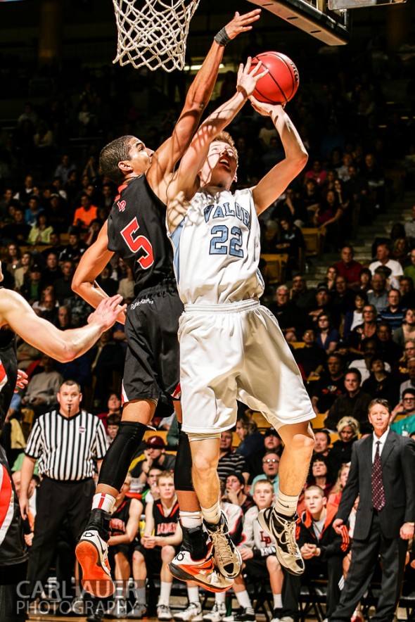 March 16th, 2013: Valor Christian Eagles junior forward Chase Foster (22) attempts to get a shot past the defense of Lewis-Palmer Rangers senior guard/forward Jordan Scott (5) in the CHSAA 4A State Championship game at the Coors Events Center in Boulder, Colorado