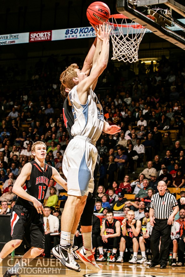 March 16th, 2013: Valor Christian Eagles junior forward Chase Foster (22) attempts a shot past the Lewis-Palmer Rangers defense in the CHSAA 4A State Championship game at the Coors Events Center in Boulder, Colorado