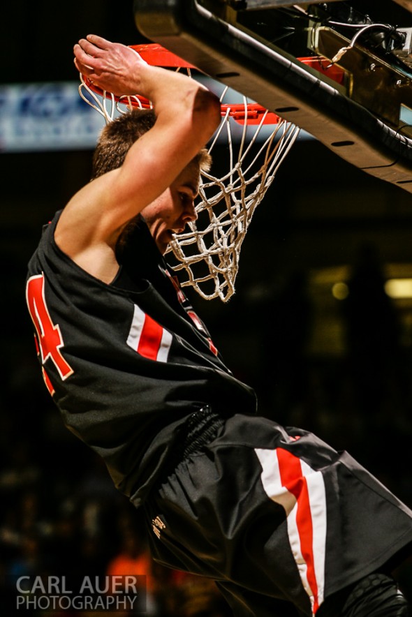 March 16th, 2013: Lewis-Palmer Rangers senior guard/forward Justin Smith (24) hangs on the rim after he slam dunked the ball in the CHSAA 4A State Championship game against the Valor Christian Eagles at the Coors Events Center in Boulder, Colorado
