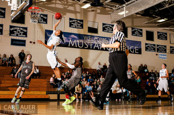 February 27th 2013: Arvada, Colorado - 6'-6" freshman Dallas Walton of the Ralston Valley Mustangs  brings people to their feet after he spins around the Smoky Hill defense and elevates for a thunderous dunk attempt.