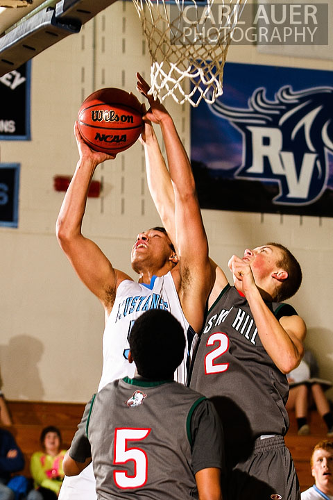 February 27th 2013: Arvada, Colorado - Ralston Valley Mustang junior Zac Stevens (5) attempts a lay up past Smoky Hill's Trent Clay in the game at Ralston Valley High School.