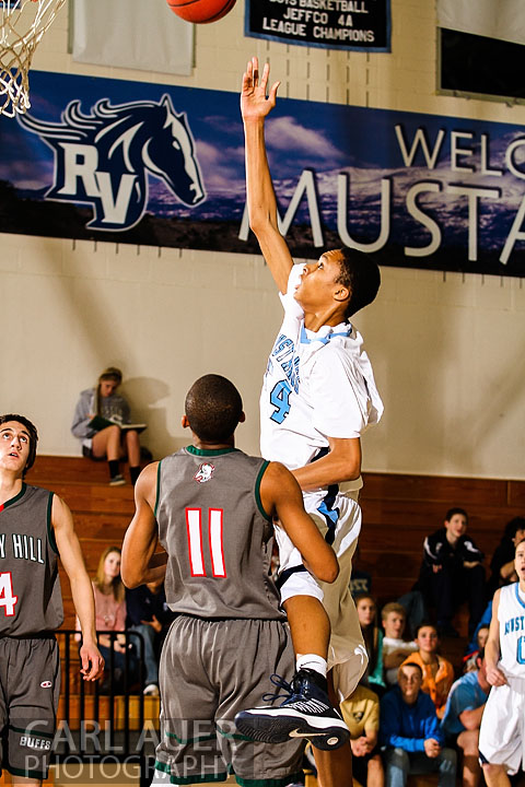 February 27th 2013: Arvada, Colorado - Ralston Valley Mustang freshman Dallas Walton (54) floats up a shot attempt in the game between the visiting Smoky Hill Buffaloes and the Ralston Valley Mustangs at Ralston Valley High School.