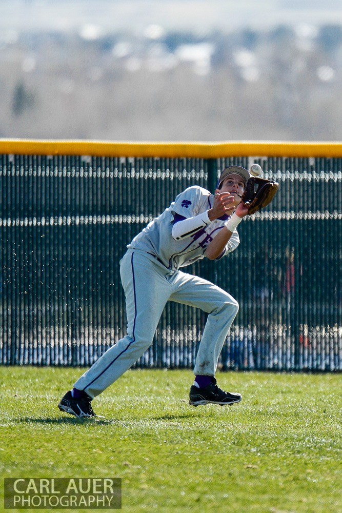 April 24th, 2013: The Arvada West right fielder makes a catch in the game against the Ralston Valley Mustangs at Ralston Valley High School in Arvada, Colorado