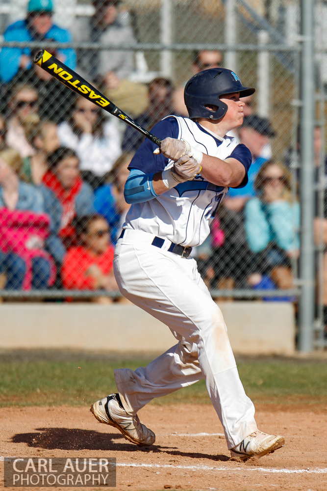 April 24th, 2013: A Ralston Valley Mustangs batter watches the ball he just hit in the game against Arvada West at Ralston Valley High School in Arvada, Colorado