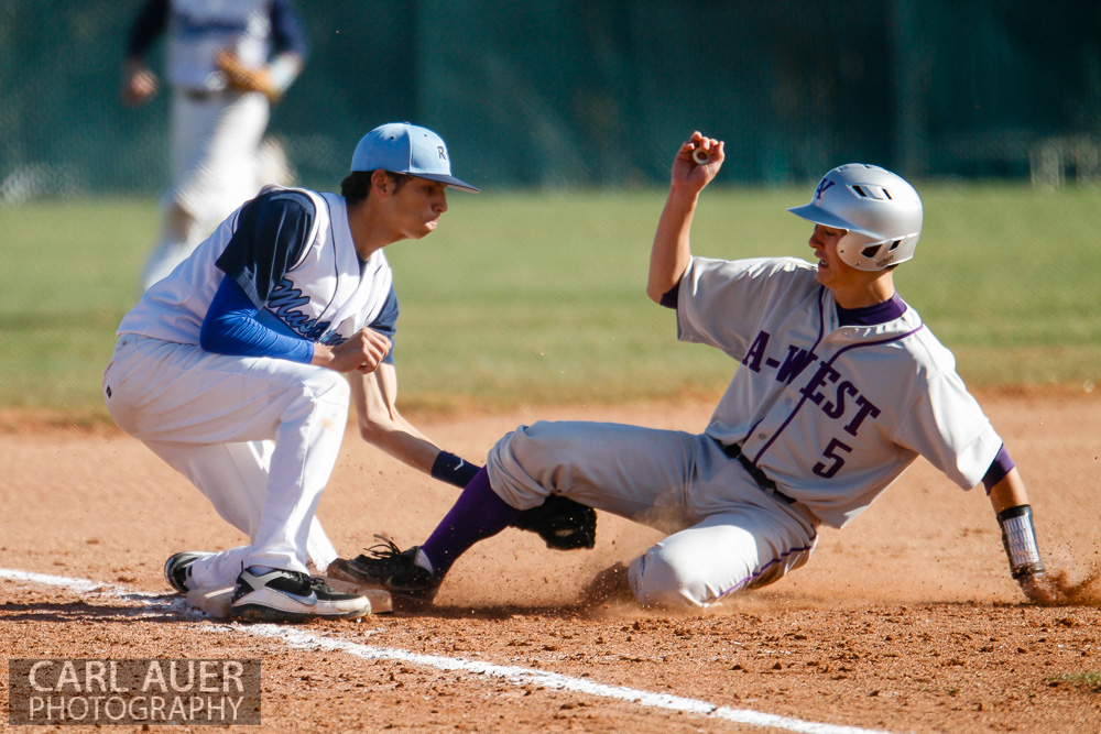 April 24th, 2013: The Ralston Valley Mustangs third baseman tags out the Arvada West baserunner in the game against Arvada West at Ralston Valley High School in Arvada, Colorado