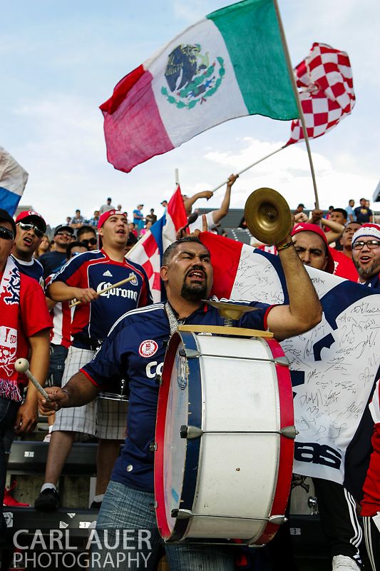 May 25th, 2013 Commerce City, CO - A Chivas USA fan bangs a drum as his team takes the field before the start of action in the MLS match between Chivas USA and the Colorado Rapids at Dick's Sporting Goods Park in Commerce City, CO