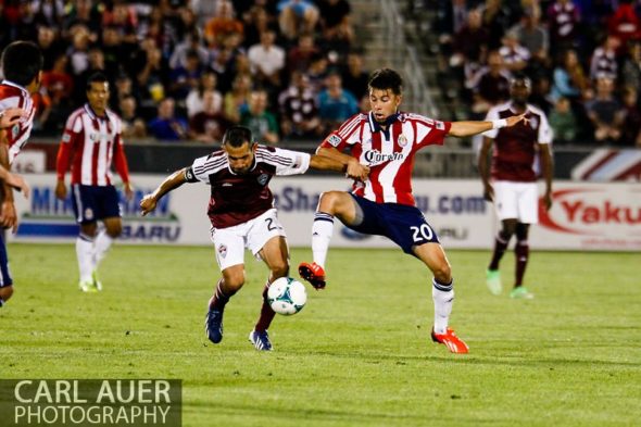 May 25th, 2013 - Chivas USA midfielder Carlos Alvarez (20) and Colorado Rapids midfielder Nick LaBrocca (2) fight for control of the ball in the second half of the MLS match between Chivas USA and the Colorado Rapids at Dick's Sporting Goods Park in Commerce City, CO