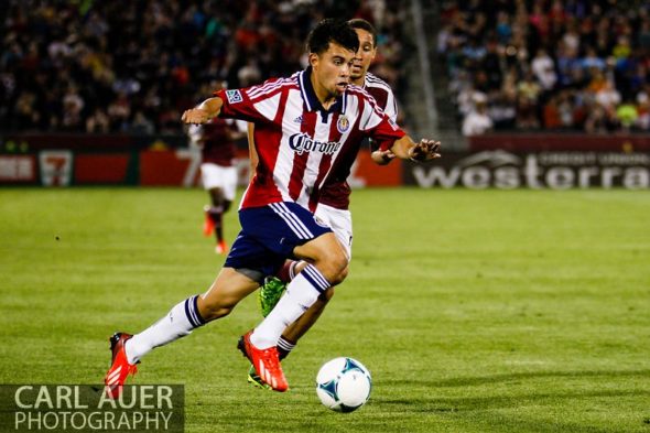 May 25th, 2013 - Chivas USA midfielder Carlos Alvarez (20) breaks towards the goal with the ball in the second half of action in the MLS match between Chivas USA and the Colorado Rapids at Dick's Sporting Goods Park in Commerce City, CO