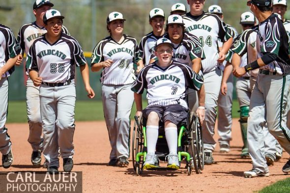 May 17th 2013: The Fleming Wildcats run wheelchair bound senior teammate Jeremy Richhard-Kind (7) around the bases after defeating the Holly Wildcats 5-3 in the CHSAA 1A Baseball final at All Star Park in Lakewood, Colorado