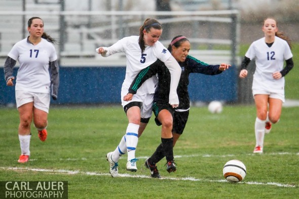 May 8th, 2013: Ralston Valley Mustang junior Maddie Allensworth (5) and ThunderRidge Grizzlies freshman Mealii Enos (14) battle for control of the ball in the CHSAA 5A Soccer Playoff game at the North Area Athletic Complex in Arvada, Colorado