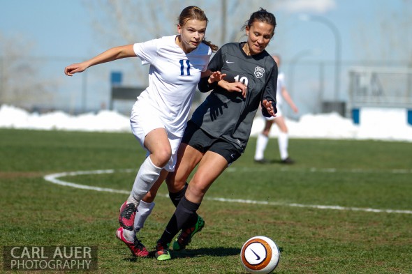 May 2nd, 2013: Ralston Valley Mustang senior midfielder Sierra Cymes (11) and D'Evelyn Jaguars senior Kendall MacCagnan (19) battle for the ball in the game at the North Area Athletic Complex in Arvada, Colorado