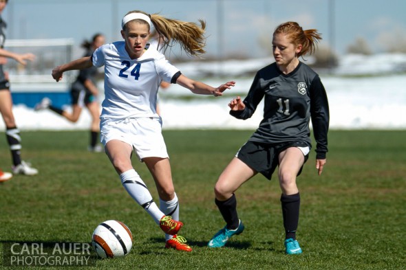 May 2nd, 2013: Ralston Valley Mustang freshman midfielder Alyssa Kaiser (24) attempts to get around D'Evelyn Jaguars senior Kerry Carmody in the game at the North Area Athletic Complex in Arvada, Colorado