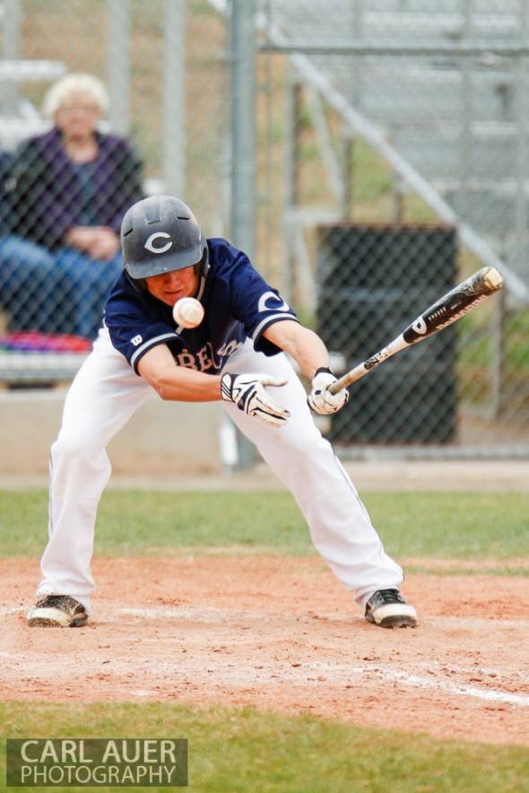 April 30th, 2013: Columbine Rebel junior Austin Anderson (24) slaps at a strike in the game against the Ralston Valley Mustangs at Ralston Valley High School