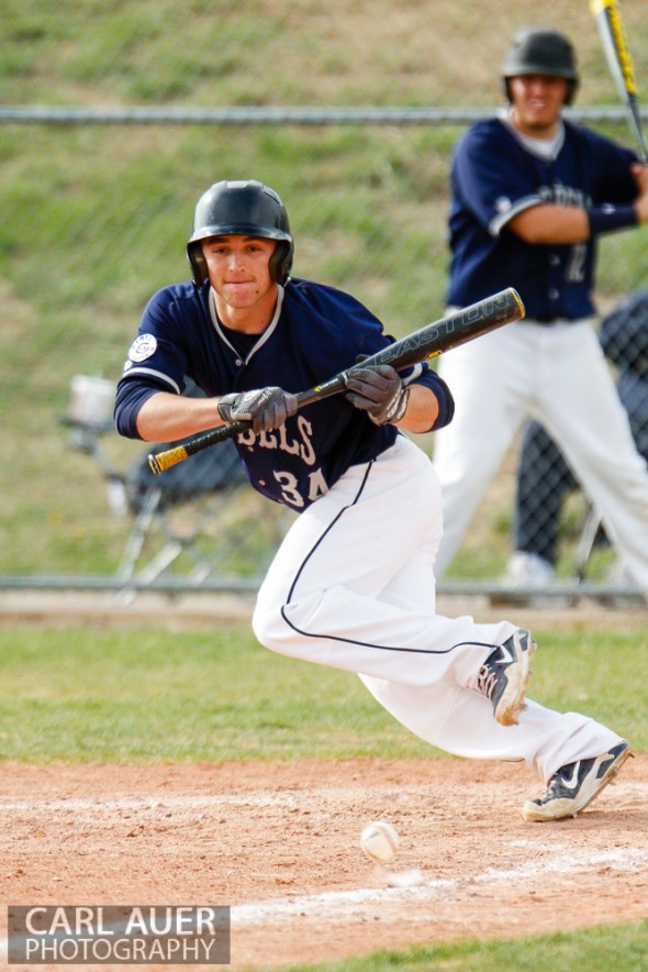 April 30th, 2013: Columbine Rebel senior Logan Smith (34) slaps a bunt down the third base line in the game against the Ralston Valley Mustangs at Ralston Valley High School