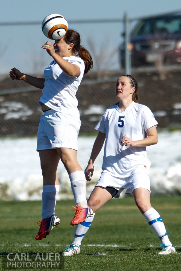 May 2nd, 2013: Ralston Valley Mustang junior midfielder Maddie Allensworth (5) watches as teammate Brenna Marinez (17), a junior midfielder/defender heads the ball in the game against the D'Evelyn Jaguars at the North Area Athletic Complex in Arvada, Colorado