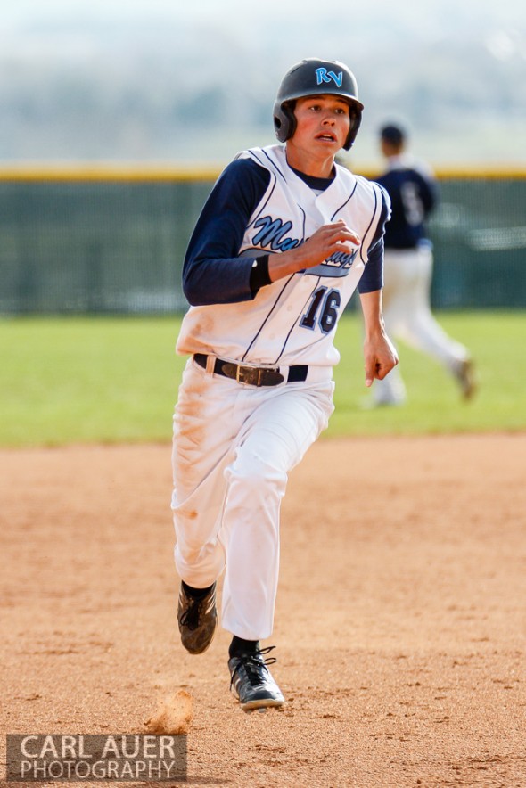 April 30th, 2013: Ralston Valley Mustangs junior Mitch Robinson (16) runs to third base after a ball reaches the outfield in the game against the Columbine Rebels at Ralston Valley High School