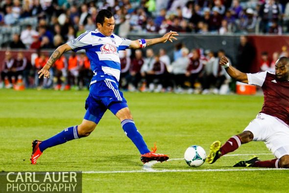 June 1st, 2013 - Colorado Rapids defender Marvell Wynne (22) slides in to break up a shot attempt by FC Dallas forward Blas Pérez (7) in the second half of action in the MLS match between FC Dallas and the Colorado Rapids at Dick's Sporting Goods Park in Commerce City, CO