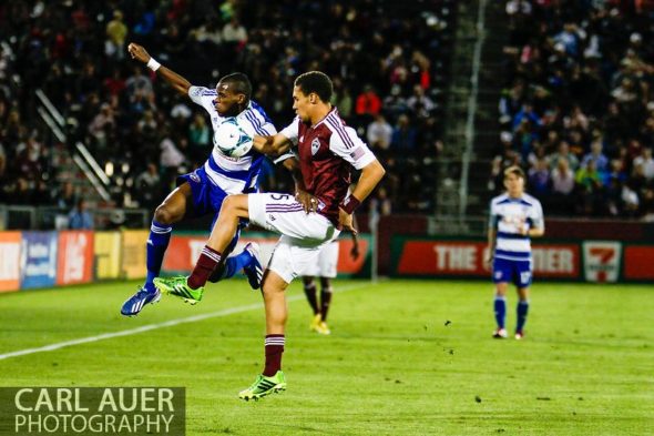 June 1st, 2013 - FC Dallas defender/midfielder Jackson (6) goes airborne to break up a down field pass attempt by Colorado Rapids defender Chris Klute (15) in the second half of action in the MLS match between FC Dallas and the Colorado Rapids at Dick's Sporting Goods Park in Commerce City, CO