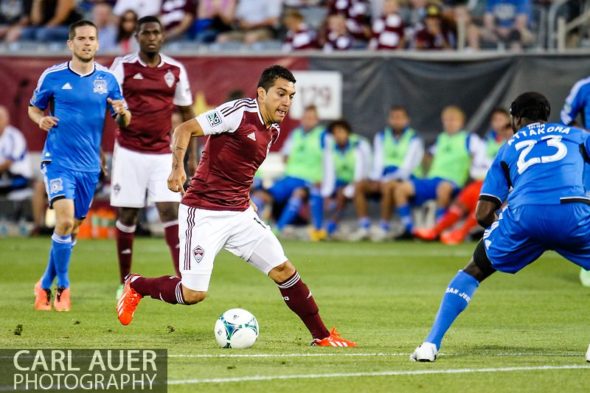 June 15th, 2013 - Colorado Rapids midfielder Martin Rivero (10) attempts to dribble the ball past the San Jose defense in the second half of the MLS match between San Jose Earthquake and the Colorado Rapids at Dick's Sporting Goods Park in Commerce City, CO