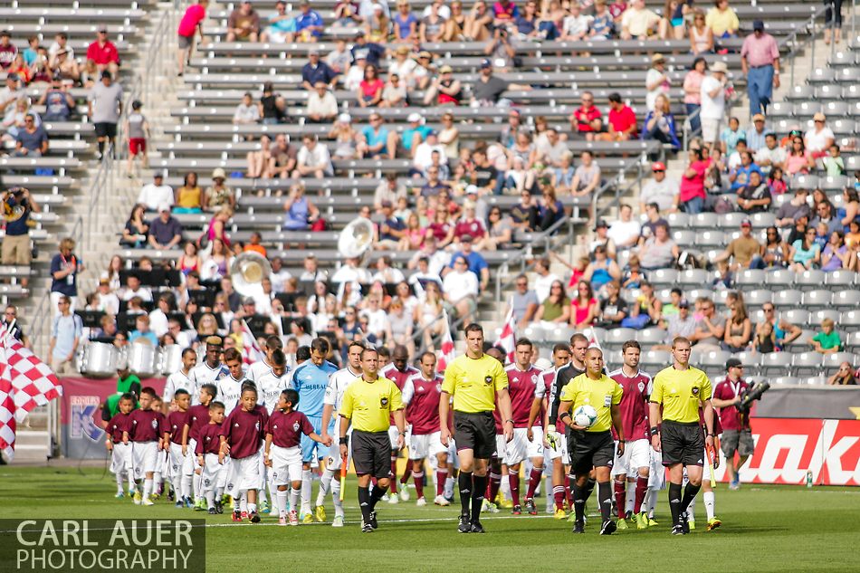 July 27th, 2013 - The LA Galaxy and Colorado Rapids are led out onto the pitch by the officials prior to the start of the Major League Soccer match between the LA Galaxy and the Colorado Rapids at Dick's Sporting Goods Park in Commerce City, CO