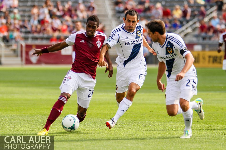 July 27th, 2013 - Colorado Rapids forward Deshorn Brown (26) attempts to drive the ball past LA Galaxy midfielder Pablo Mastroeni (6) and defender Todd Dunivant (2) in the first half of action in the Major League Soccer match between the LA Galaxy and the Colorado Rapids at Dick's Sporting Goods Park in Commerce City, CO