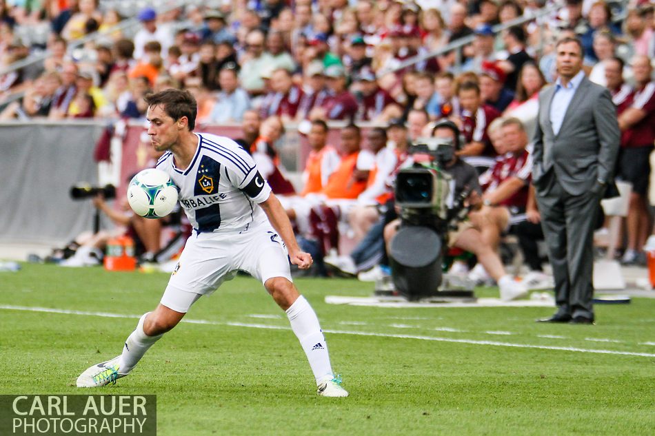 July 27th, 2013 - In front of his head coach Bruce Arena, LA Galaxy defender Todd Dunivant (2) collects a pass with his chest late in the second half of the Major League Soccer match between the LA Galaxy and the Colorado Rapids at Dick's Sporting Goods Park in Commerce City, CO